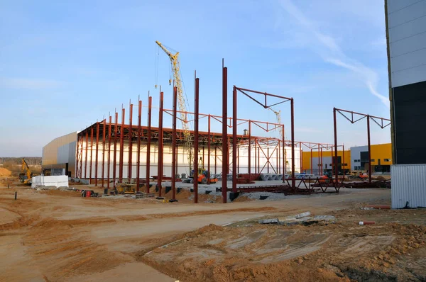 New construction of a warehouse logistics warehouse. Installation of metal structures. construction site