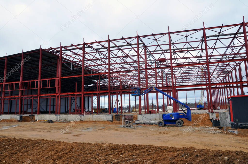 New construction of a warehouse logistics warehouse. Installation of metal structures. construction site