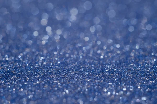 Abstract New Year blue bokeh background with shining defocus sparkles. Blurred glitters shimmering dust macro close up, copy space for text logo — Stock Photo, Image