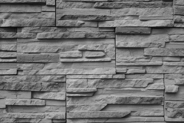 Close-up ancient wall, slim granite brick. — Stock Photo, Image