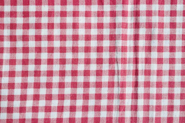 Röd picknick bordsduk bakgrund. — Stockfoto