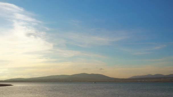 Beautiful lake and white boat floats into distance. — Stock Video