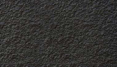 Yeni asfalt yakın plan. Siyah arkaplan veya doku.