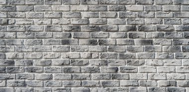Gri tuğla duvar. El yapımı tuğla duvar.