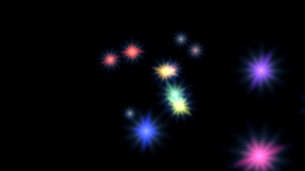 Boucle d'étoiles tournantes. Sur un fond noir, les étoiles multicolores tournent. Vous pouvez boucler en toute transparence .