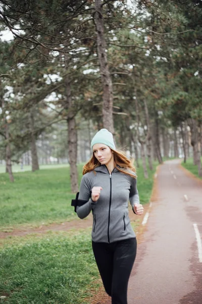 Young woman running in park