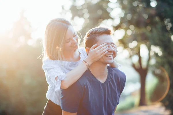 Happy young couple in park