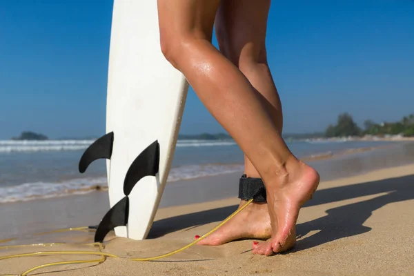 Young beautiful surfer girl on beach with surf board at day brea — Stock Photo, Image