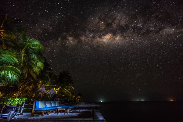 Landscape with Milky way galaxy. Night sky with stars and sea.