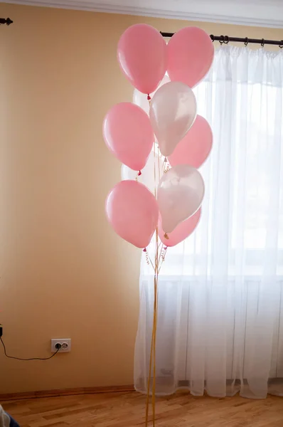 White and rose air ballons in the room