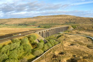 Aerial of The Ribblehead Viaduct a Grade II listed structure, the Viaduct runs the Settle to Carlisle railway route in North Yorkshire, England. clipart