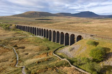 Aerial of The Ribblehead Viaduct a Grade II listed structure, the Viaduct runs the Settle to Carlisle railway route in North Yorkshire, England. clipart