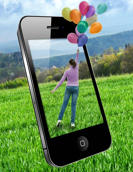 Mobile phone image on the screen - woman with balloons — Stock Photo, Image