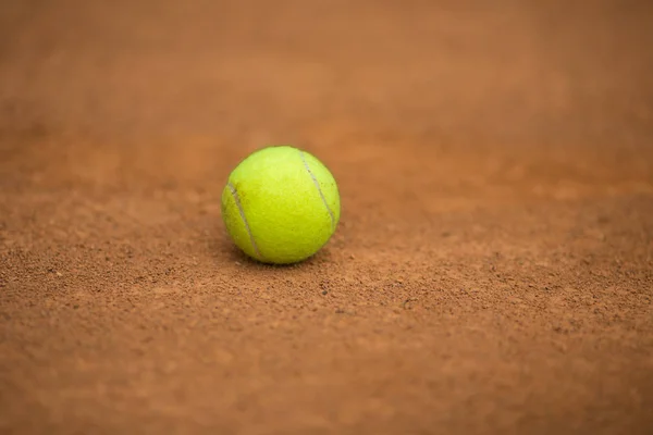 a tennis ball on the ground