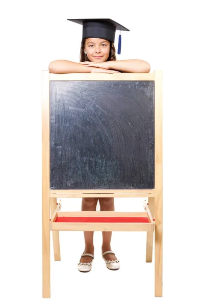 Girl leaning on blackboard — Stock Photo, Image