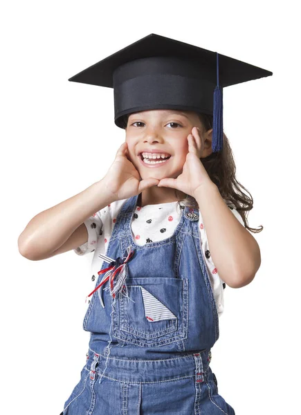 Schoolgirl wearing a university cap — Stock Photo, Image