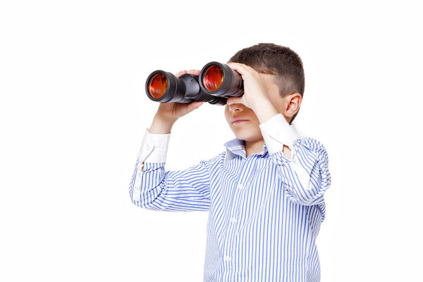 Young boy using binoculars