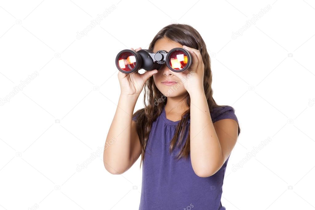 Young girl using binoculars