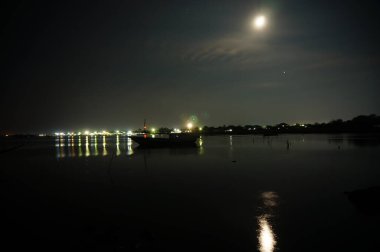 Coastal is a meeting area between land and sea at night which is quiet when sea water starts to tide