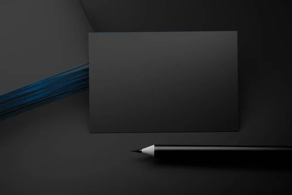 Business cards and one sharp pencil on dark background — ストック写真