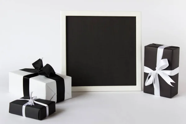 Photo picture frame with gift boxes and bows — Stock Photo, Image