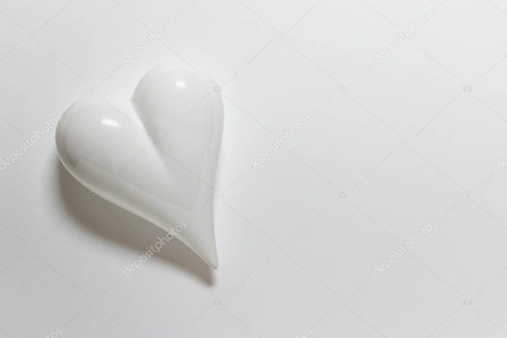 White porcelein heart on white backgound