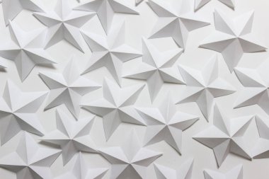 White backgound with many paper folded stars