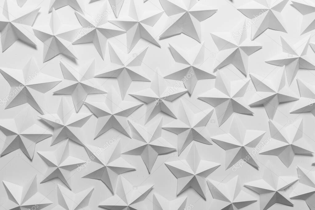 Many folded paper stars on white background