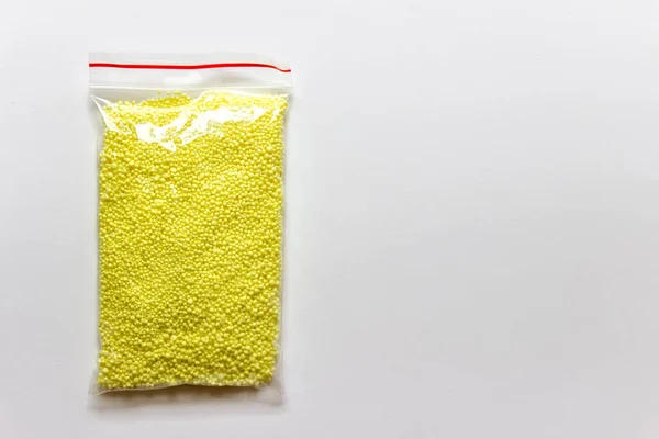 Granules Yellow Sulfur Chemical Element Plastic Bag White Background Photo — Stock Photo, Image