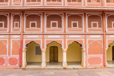 Pink facade of the Chandra Mahal building at the city palace in  clipart