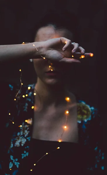 Young Woman Glowing Makeup Black Dress Garland Lights — Stock Photo, Image