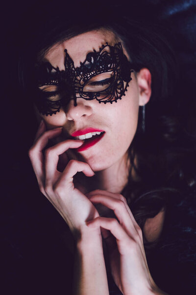 portrait of a beautiful woman with black hair and creative make-up and hairstyle