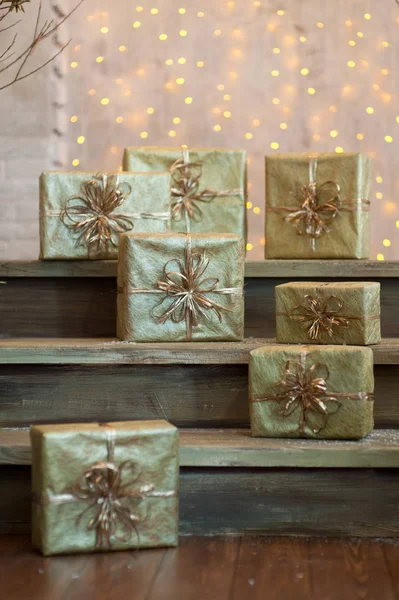 Golden gift boxes on abstract background — Stock Photo, Image