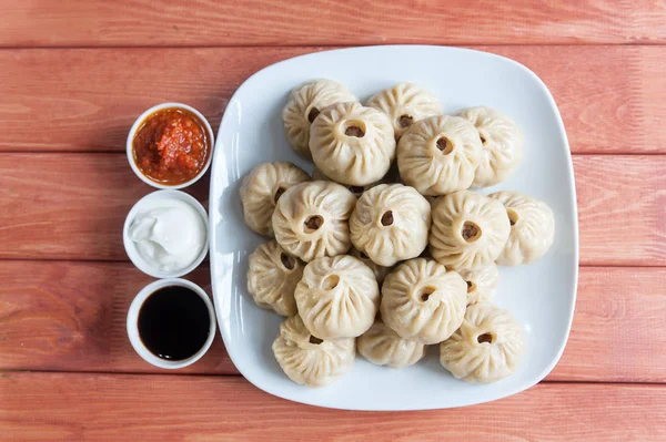 Buuza poza bir Buryat Moğol ulusal, Yapıştır paket yemektir