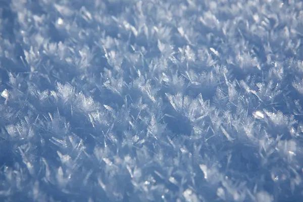 Die natürliche Textur des Schnees — Stockfoto