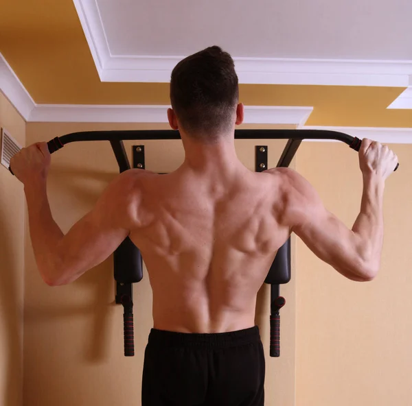 A young man demonstrates torso — Stock Photo, Image