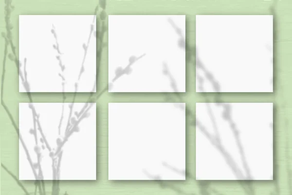 Folhas Quadradas Papel Texturizado Branco Sobre Fundo Parede Verde Claro — Fotografia de Stock