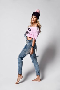 Trendy hipster girl photo in fashion urban outfit