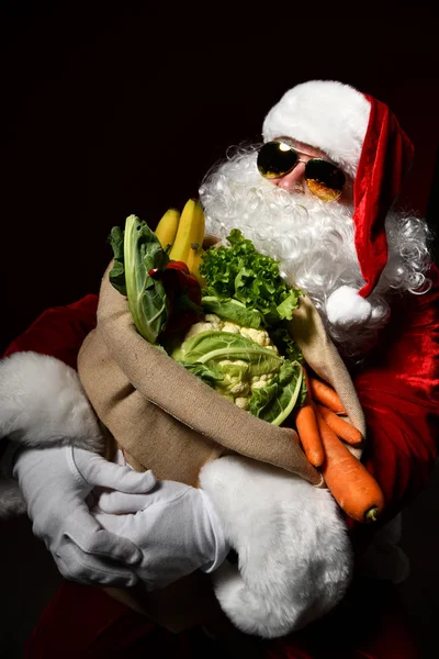 Santa Claus with a bag full of vegetables and fruits — Stock Image Santa Claus with a bag full of vegetables and fruits Stock Photo