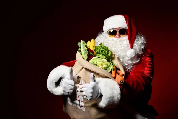 Santa Claus with a bag full of vegetables and fruits — Stock Image Santa Claus with a bag full of vegetables and fruits Stock Picture