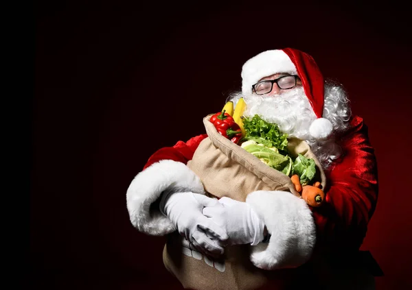 Santa Claus with a bag full of vegetables and fruits — Stock Image Santa Claus with a bag full of vegetables and fruits Stock Image