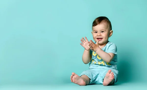 Little cute baby in blue t-shirt isolated — Stock Photo, Image