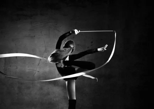 Beautiful Blond Hair girl gymnast training with the gymnastics tape. Flexible gymnastics girl doing exercises — 스톡 사진