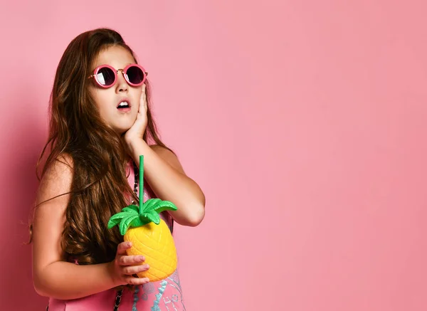 Young plus size girl in bright summer casual clothing and sunglasses holding healthy diet cocktail in hand and feeling surprised — 스톡 사진