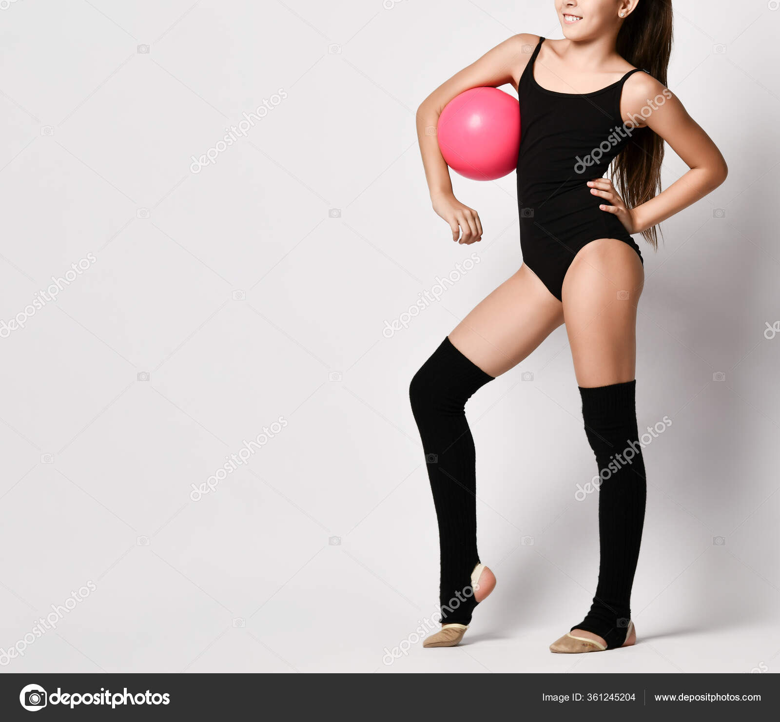 Cropped Photo Of Girl Gymnast In Black Body And Leggings Is