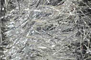 Arka plan, gümüş rengi parlak ya da Noel ağacında ışıldayan süsler. Bulanık arkaplan