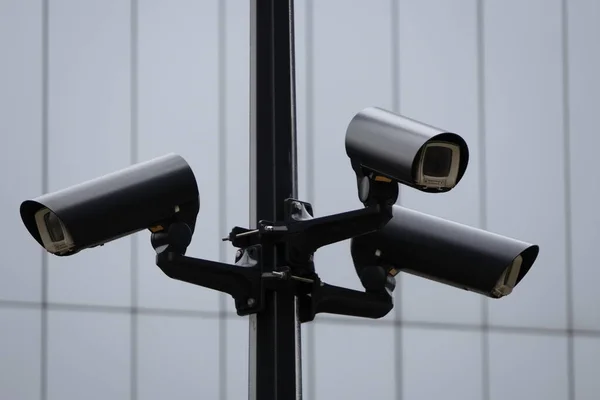 Video surveillance system on a pole, three cameras are turned in