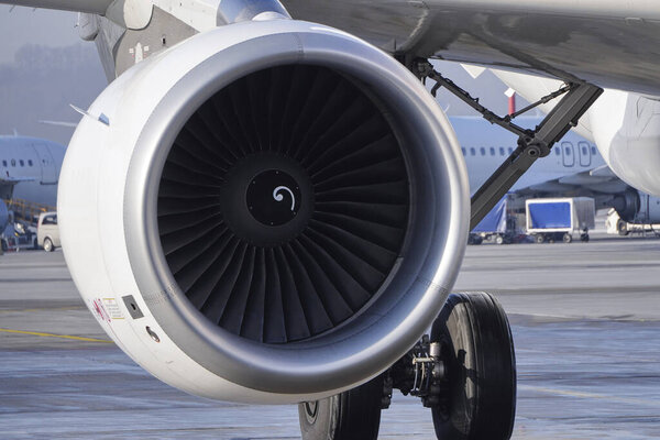 Krakow, Poland 20.12.2019: turbine jet engine CFMI CFM56-5B passenger aircraft airbus A320, on the background of the runway. turbine blades, civil aviation, aircraft engine manufacturing