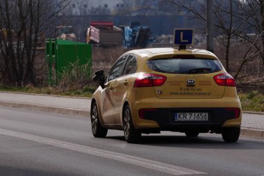 Krakow, Poland 02.15.2020: Training L-signed car's roof on street. Driving license school.