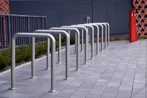 no bikes are fixed to metal structure for Parking bicycles or scooters, environmental transport in the city. Moving by bike every day. bicycle at street parking outdoors